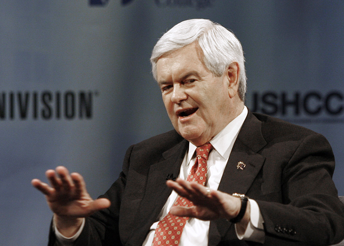 Republican Presidential candidate gestures during Florida's "Meet the Candidates" forum, hosted by Univision, on Jan. 25, 2012. (AP Photo/Jeffrey M. Boan)