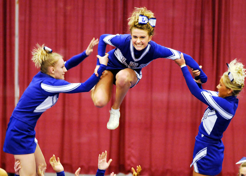 UP, UP AND AWAY: The Lawrence High School cheerleaders compete on their way to a fourth-place finish at the Kennebec Valley Athletic Conference Class A Cheerleading Championship on Monday at the Augusta Civic Center.
