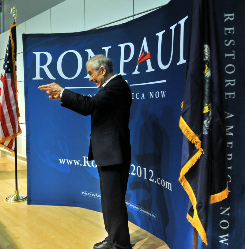 Staff photo by Michael G. Seamans Republican Party presidential hopeful, Ron Paul, greets supporters after speaking at the Ostrove Auditorium at Colby College on Friday.