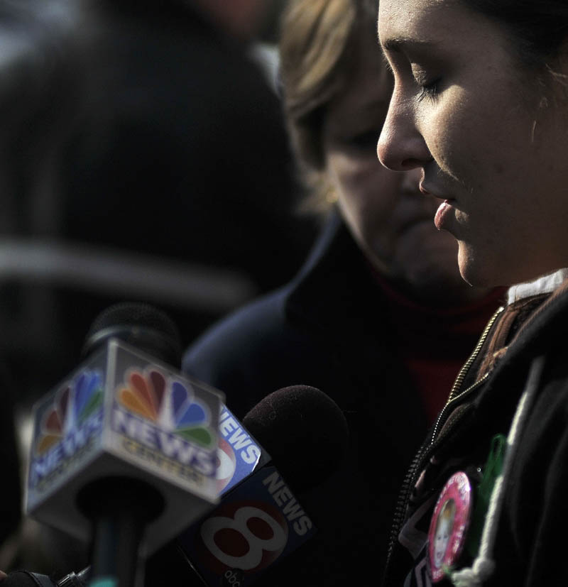 Staff photo by Michael G. Seamans Trista Reynolds talk with media during a vigil in Castonguay Square in Waterville for her missing toddler, Ayla Reynolds Saturday.