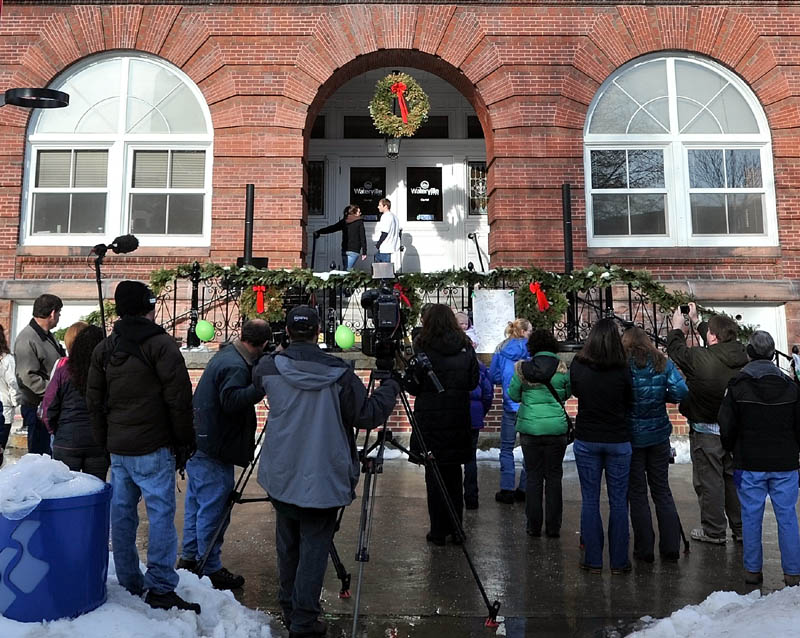 PRIVATE CHAT: Trista Reynolds and Justin DiPietro stand on the steps of the Waterville City Hall and have a private discussion following a vigil Saturday for their missing toddler, Ayla Reynolds.