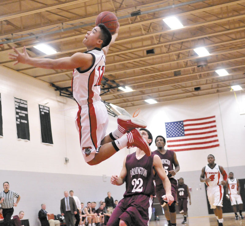 ON THE RISE: Thomas College’s Antonio Juco dunks the ball on a fastbreak against University of Maine at Farmington during the Terriers’ 81-73 win Saturday at Mahaney Gymnasium in Waterville.