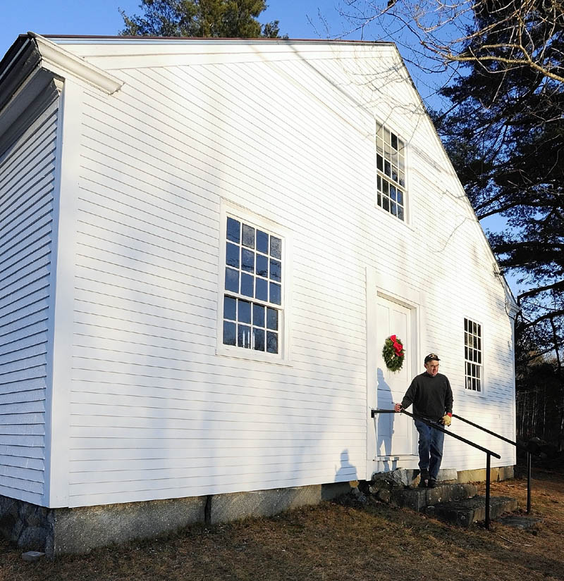 Bob Stephenson walks out of the Wayne Town House after giving a tour. The historic building is located on Route 133 across the road from the state boat launch.