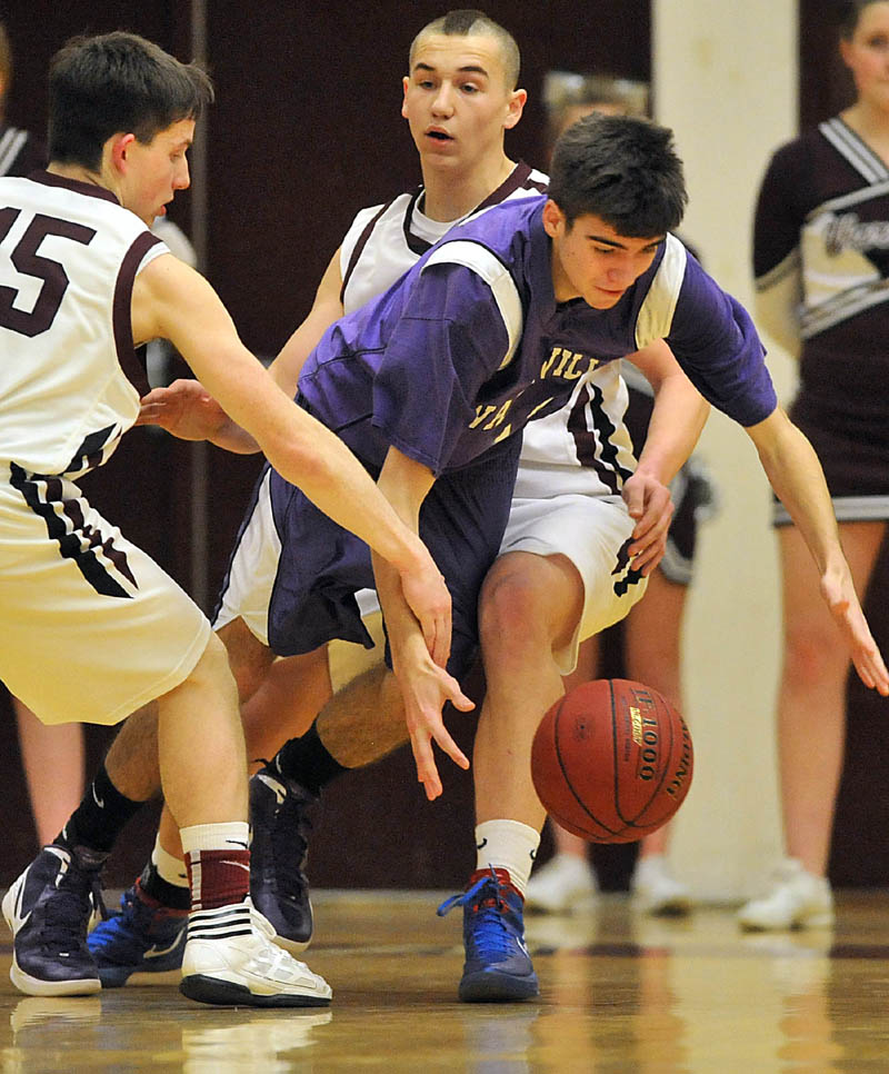 Photo by Michael G. Seamans Game action from Eastern Class B boys playoff game at Nokomis High School in Newport Wednesday night. Nokomis defeated Waterville 50-49 in overtime..