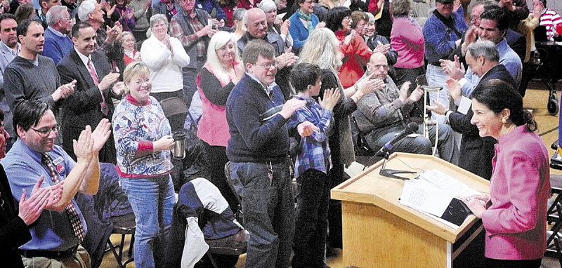 NOT RUNNING: U.S. Sen. Olympia Snowe gets a standing ovation as she speaks during the Kennebec County Super Caucus at Farrington School in Augusta earlier this month.