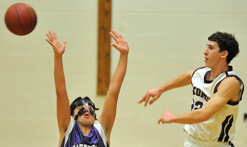 Photo by Michael G. Seamans Game action from Eastern Class B boys playoff game at Nokomis High School in Newport Wednesday night. Nokomis defeated Waterville 50-49 in overtime..