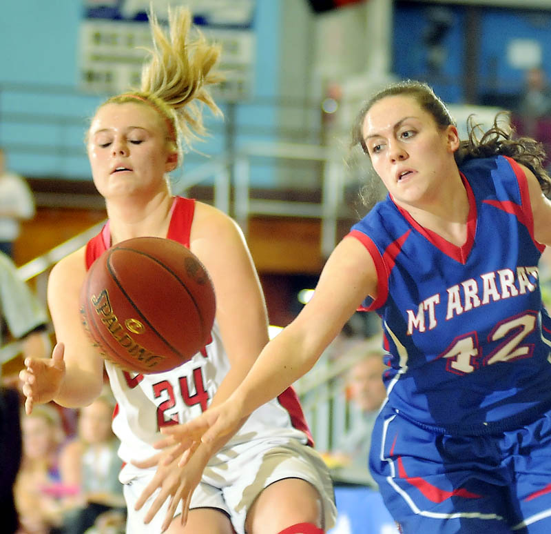 Cony High School's Emily Sanford, left, is stripped of the ball by Mt. Ararat High School's Mallory Nelson during a basketball match up Wednesday in Augusta.