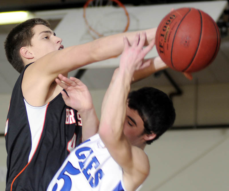BLOCKED: Erskine’s Devin Duncan, right, blocks a shot by Brunswick’s John Almgren during a game Tuesday in South China.