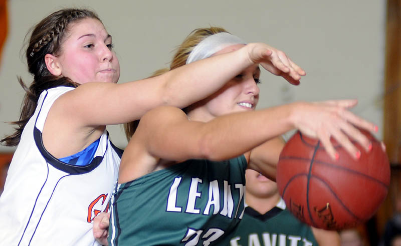 PRESSURE ON: Gardiner Area High School's Kylee Granholm, left, guards Leavitt Area High School's Amanda Jordan during a basketball game Thursday in Gardiner.