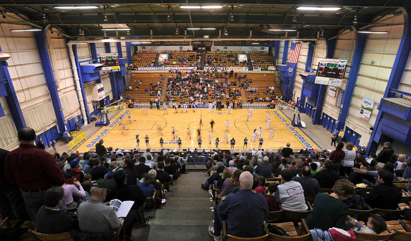 Photo by Michael G. Seamans Gardiner High School and Mount Desert Island High School warm up prior to the first half of the Eastern Class B quarterfinals game at the Bangor Auditorium Saturday. Gardiner defeated MDI 63-38.