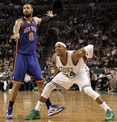 Boston Celtics' Paul Pierce (34) and New York Knicks' Tyson Chandler (6) watch a 3-point shot by Pierce during the second quarter Friday in Boston.