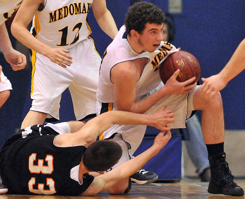 Photo by Michael G. Seamans in the first half of the Eastern Class B semi-finals at the Bangor Auditorium Wednesday. Gardiner defeated Medomak Valley 57-46.