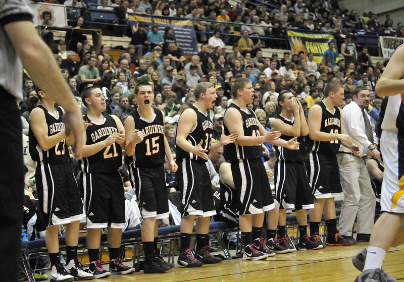 Photo by Michael G. Seamans Gardiner High School cheers a three-point shot late in the second half of the Eastern Class B semi-finals against Medomak Valley High School at the Bangor Auditorium Wednesday. Gardiner defeated Medomak Valley 57-46.