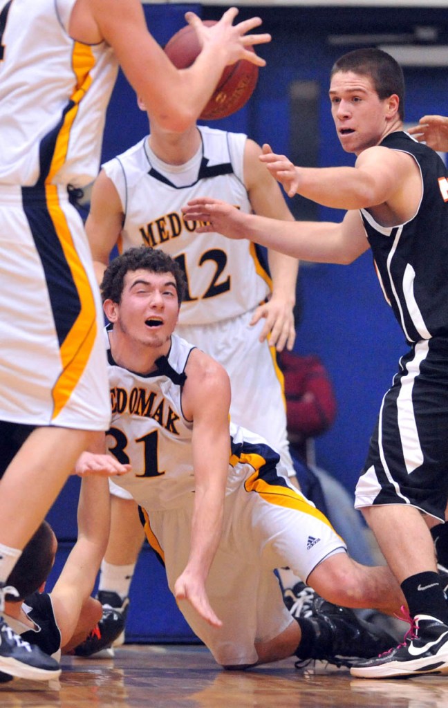 Photo by Michael G. Seamans in the first half of the Eastern Class B semi-finals at the Bangor Auditorium Wednesday. Gardiner defeated Medomak Valley 57-46.