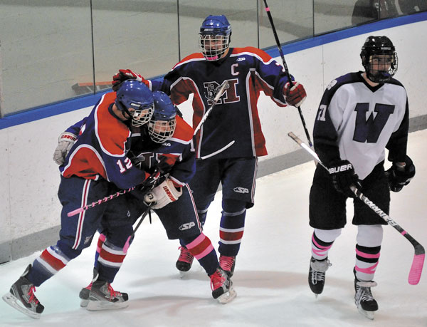 NEXT STEP: Messalonskee teammates, from left, Chase Cunningham, James Varney and Sam Dexter will host No. 7 John Bapst at 6 tonight at Sukee Arena. The Eagles finished two regular-season victories shy of matching the program record of 17.