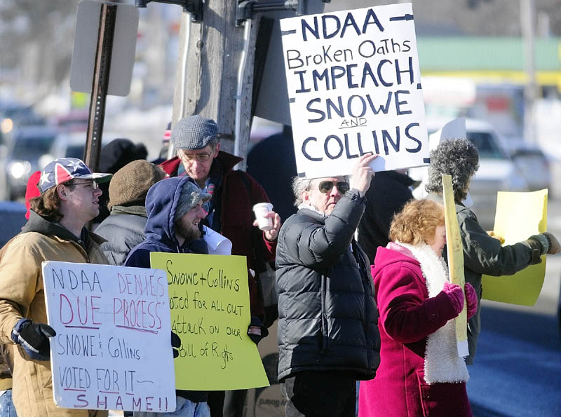 About two dozen people gathered at noon Friday outside the Muskie Federal Building in Augusta to protest the National Defense Authorization Act and the votes of support by U.S. Sen. Susan Collins and U.S. Sen. Olympia Snowe. A group spokeswoman said that the group also planned to deliver a letter to the senators’ offices in the building, outlining their concerns that the act allows the detention of American citizens and violates due process.