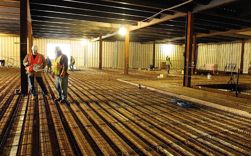 TAKING SHAPE: Workers talk on the second-floor operating rooms Tuesday afternoon at the construction site of the new MaineGeneral hospital in North Augusta.