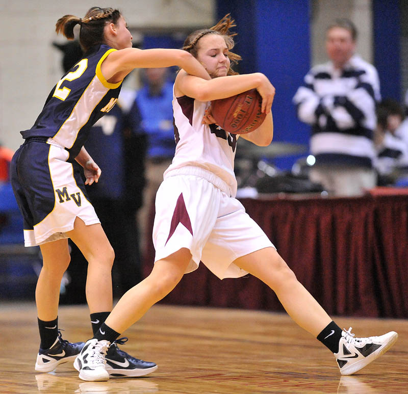 Photo by Michael G. Seamans in the second half of the Eastern Class B quarterfinals game at the Bangor Auditorium Saturday. Nokomis defeated Medomak Valley 58-51.