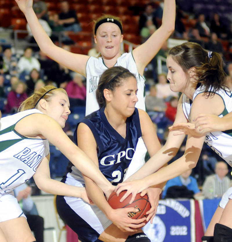 NOWHERE TO GO: Greater Portland Christian’s Suzanne Gonzalez, center, is surrounded by Rangeley defenders, left to right, Seve Deery-DeRaps, Taylor Esty and Emily Carrier during a Western D girls basketball quarterfinal Monday in Augusta. Second-seeded Rangeley won 65-43 and will play sixth-seeded Vinalhaven at 10 a.m. Thursday in the semifinals.