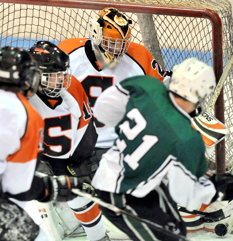 SHUTOUT PERFORMANCE: Skowhegan goalie Sam Edmondson makes one of his 17 saves during a 3-0 victory against Old Town on Wednesday night at Sukee Arena in Winslow.