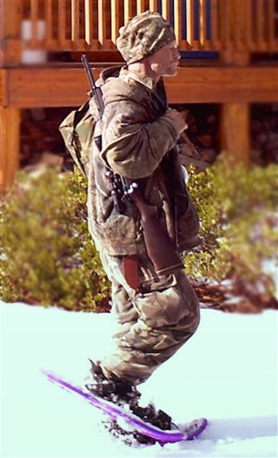 This undated file photo provided by the Iron County Sheriff's Office in January, shows a man who authorities on Tuesday, Feb. 21, 2012 identified as Troy James Knapp, walking past a cabin in the remote southern Utah wildness near Zion National Park. Authorities say Knapp, captured by a motion-triggered surveillance camera sometime in December, has been linked to more than two dozen cabin burglaries over the past five years. (AP Photo/Iron County Sheriff)