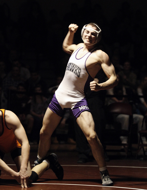 Nicholas Janes of Marshwood celebrates a victory over Skowhegan's Carter Stevens in the 145-pound class during the Class A State Championships.