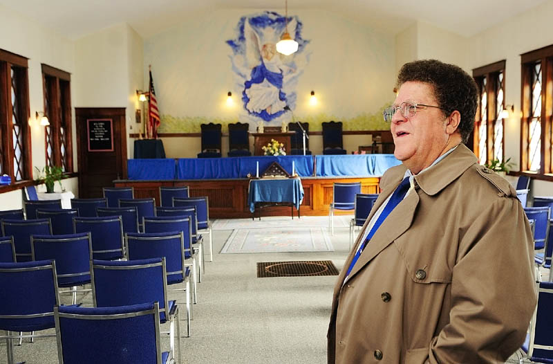 READY TO GO: The Rev. Earl Wallace talks about plans to move the Augusta Spiritualist Church from Perham Street in Augusta during an interview there Wednesday.