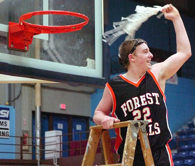 GIVE IT A TWIRL: Forest Hills junior forward Derick Ouellette swings the net after cutting it down to celebrate the Tigers’ victory over Hyde School in the Western Maine Class D championship game on Saturday afternoon at the Augusta Civic Center. Trailing by 19 points late in the third quarter, Forest Hills mounted a furious comeback to advance to Saturday’s state title game against Jonesport-Beals.