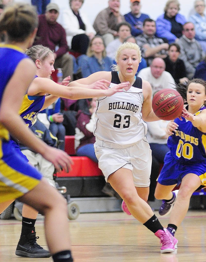 COMING THROUGH: Hall-Dale High School’s Carylanne Wolfington drives through the Boothbay Region High School defense during a game Tuesday night in Penny Memorial Gym at Hall-Dale High in Farmingdale.