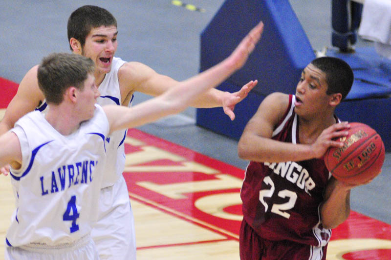 Lawrence's Tim Dudley, left, and Spencer Carey defend against Bangor's Xavier Lewis during the Class A East tournament on Saturday afternoon at the Augusta Civic Center.
