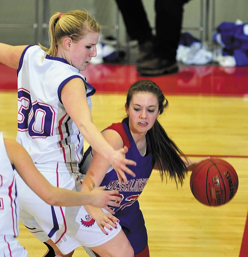 Mt. Ararat's Leah Hitchcock, left, covers Messalonskee's Kassi Michaud during the Class A East tournament on Friday night at the Augusta Civic Center. richmond buckfield standish softball