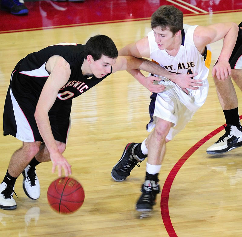 Brunswick's Mitchell Black, left, tries to get past Mt. Blue's Eric Berry during the Class A East tournament on Saturday afternoon at the Augusta Civic Center.
