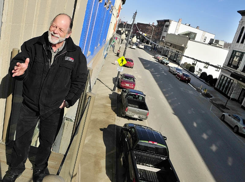 Owner Richard Parkhurst stands on the new balcony of the old Chernowsky's building talking about developments in downtown Augusta.