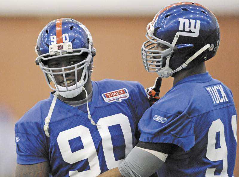 IMPOSING DUO: Defensive ends Jason Pierre-Paul, left, and Justin Tuck are part of an imposing New York Giants defensive line which will try to make life miserable for Patriots quarterback Tom Brady in the Super Bowl on Sunday.