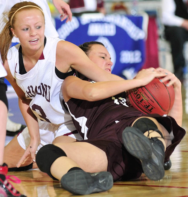 GIVE ME THAT: Richmond’s Noell Acord, left, and Buckfield’s Danielle Patrie wrestle for a loose ball during the Western Maine Class D quarterfinals Tuesday morning at the Augusta Civic Center.