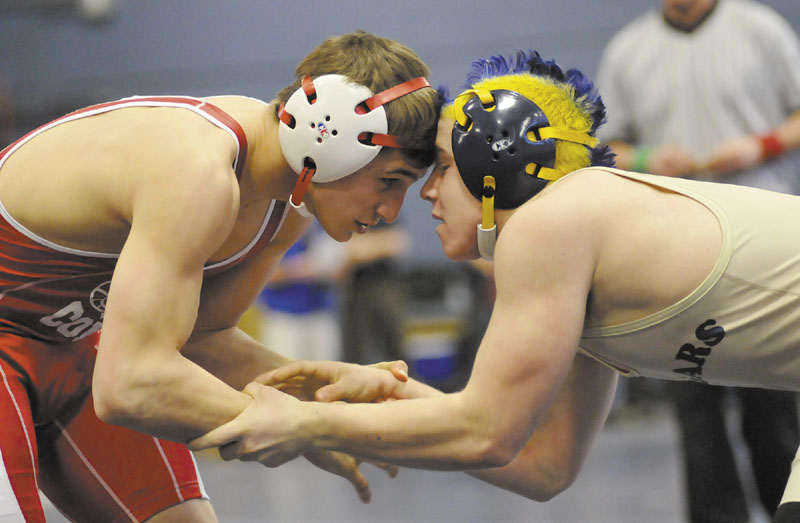 LOCKED UP: Cony’s Chris Paradis, left, and Mt. Blue’s Drew Blanchet wrestle in a 138-pound match Saturday afternoon in Westbrook. Skowhegan’s Kaleb Brown pinned Cony’s Chris Paradis in 59 seconds to win the 138 crown. Blanchet finished third.