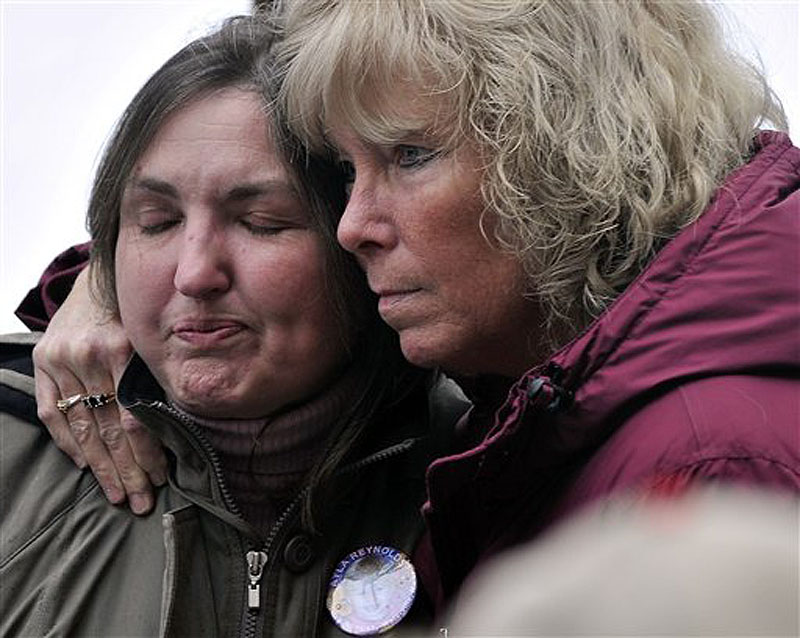 Phoebe DiPietro, grandmother of missing toddler Ayla Reynolds, is comforted by an unidentified woman during a vigil for Reynolds at Castonguay Square in downtown Waterville, Maine on Saturday, March 3, 2012. Reynolds, who was 20 months old, was reported missing by her father Justin DiPietro, from his Waterville home on Dec. 17, 2011.