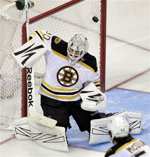 San Jose Sharks left wing Daniel Winnik, not shown, scores past Boston Bruins goalie Tim Thomas (30) in the third period of an NHL hockey game in San Jose, Calif., Thursday, March 22, 2012. (AP Photo/Paul Sakuma)