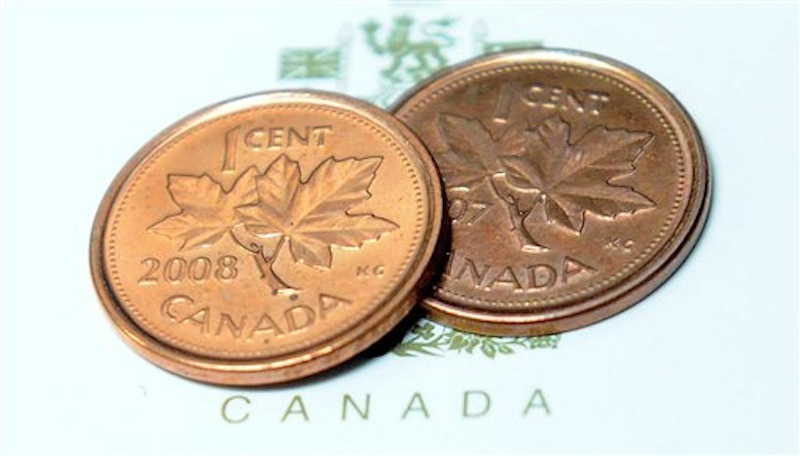 Pennies are shown in Ottawa on Thursday, March 29, 2012. The humble one-cent piece is set to disappear from Canadian pockets, a victim of inflation. Thursday's federal budget said the Royal Canadian Mint will strike the last of the little coins this fall. Responses Friday were mixed, with some Canadians saying it would make life easier, while others worried it would become an opening for sneaky price hikes. (AP Photo/The Canadian Press, Sean Kilpatrick) Parliament;accountability;assemble;assembly;Canada;Canadian;diplomatic;gather;government;leader;leadership;MP;MPs;political;politics;representative;budget;allowance;briefing;expense;finance;financial;fiscal;funds;issue;issues;money;policy;politician;resources;spend;spending;statement;tax;taxation;taxes