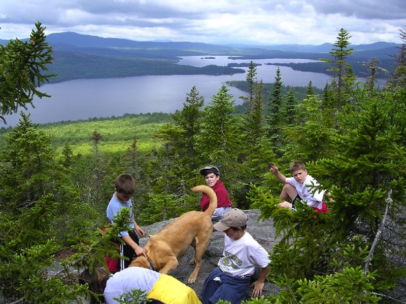 A group explores Bald Mountain. Mining officials and the Lake Portage town manager would like to open a new gold and silver mine on the mountain, but others say that would hurt the fishing, hunting and tourism industries, which also provide jobs.