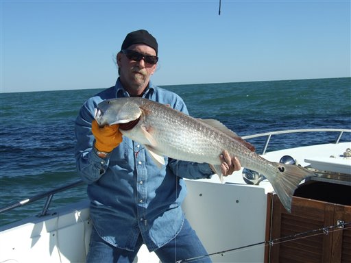 This undated photo shows Ed Coen during a fishing trip. Coen died after he and friend Ken Henderson's boat sank in the Gulf of Mexico. Henderson managed to swim to a natural gas rig for help more than 30 hours after the boat started taking taking on water and both engines failed.