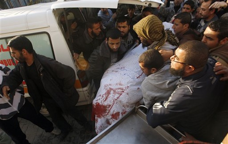 Palestinian carry the body of Zuhair al-Qaissi, a commander of the armed wing of the Popular Resistance Committees (PRC) in Gaza City on Friday, March 9, 2012. An Israeli airstrike killed top Palestinian militant commander Zuhair al-Qaissi and a second militant in Gaza on Friday in the highest profile attack against the coastal strip in months. (AP photo/Hatem Moussa)