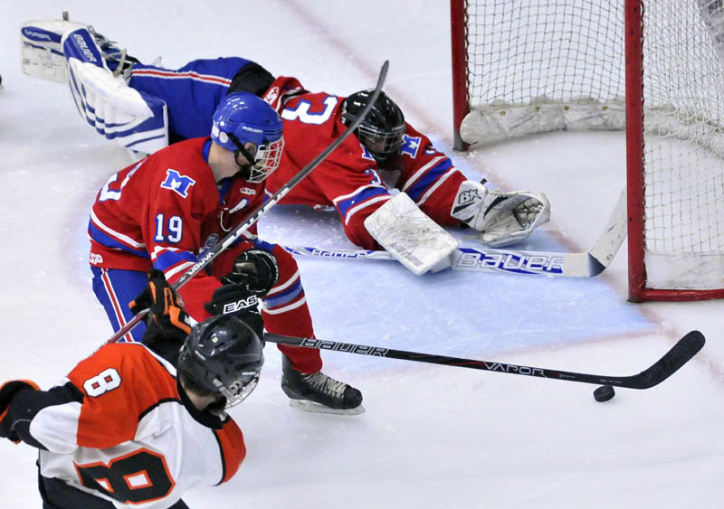 Photo by Michael G. Seamans in the third period of the Class B East hockey regional finals at Alfond Arena at the University of Maine in Orono Tuesday night. Messalonskee defeated Brewer 5-2.