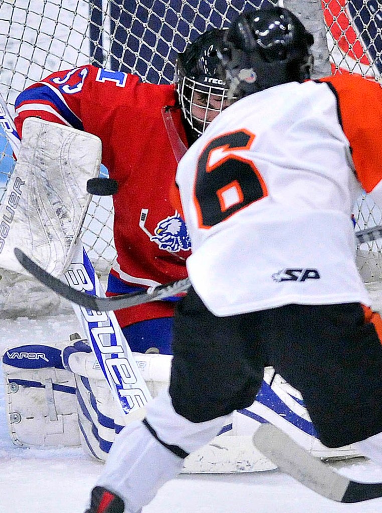 Photo by Michael G. Seamans in the second period of the Class B East hockey regional finals at Alfond Arena at the University of Maine in Orono Tuesday night.