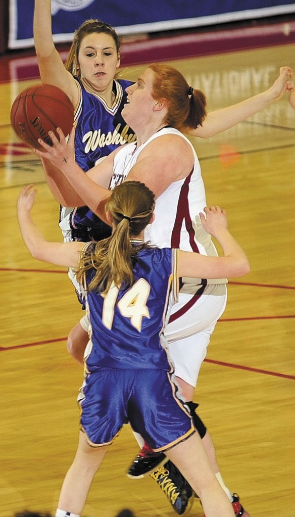 Richmond's Alyssa Pearson tries to shoot over Washburn's Olivia Doody, top, and Mackenzie Worcester in the Class D state championship game on Saturday afternoon at the Augusta Civic Center.