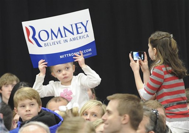 Bella Mow, 4, sits on her father Michael's shoulders and had her picture taken by Savannah Stewart, 9, as they wait for the arrival of Republican presidential candidate Mitt Romney on Thursday, March 1, 2012 in Idaho Falls, Idaho. (AP Photo/The Idaho Post-Register) rb;romney;mitt;gop;election;vote;skyline;campaign;waite;stewart;mow