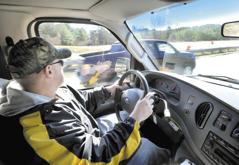 Maine State Police trooper Steven Stubbs spots this driver using his cell phone and speeding and issued him a ticket as Stubbs and fellow trooper Mike Cook patrol the Maine Turnpike in a unmarked van looking for drivers who are texting.