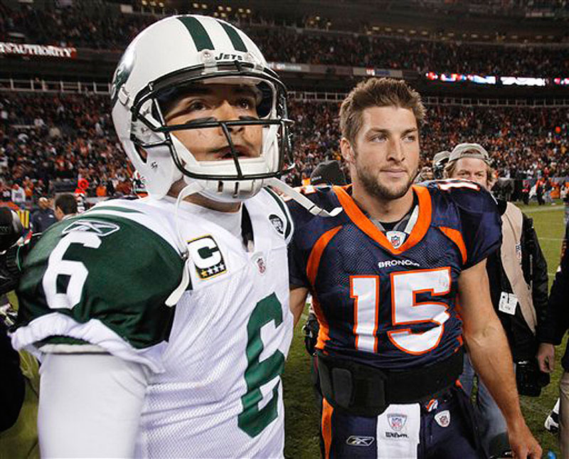 In this Nov. 17, 2011 photo, New York Jets quarterback Mark Sanchez (6) and Denver Broncos quarterback Tim Tebow (15) walk off the field together after an NFL football game, in Denver.