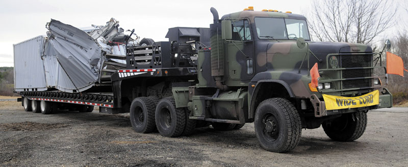 A military tractor trailer struck an overpass Friday on the Maine Turnpike in West Gardiner.