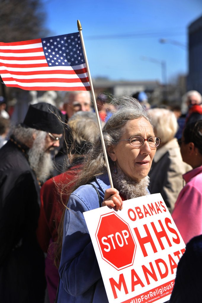 Cindi Redmond, 59, of Litchfield joins about 120 demonstrators Friday in a rally organized by Stand Up for Religious Freedom outside the federal courthouse on Federal Street in Portland. The protest was part of a national campaign opposing mandated birth-control coverage.